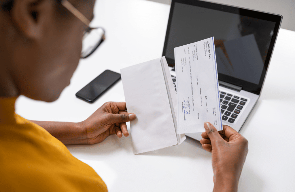An employee opening a short paycheck